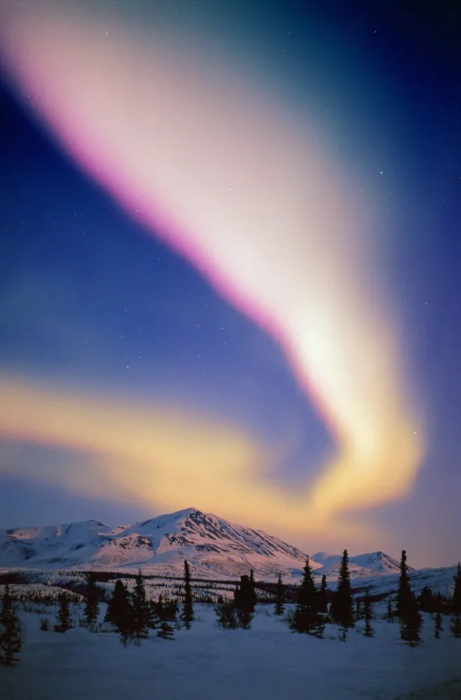 Snowy northern lights scene in Alaska — Getty Images