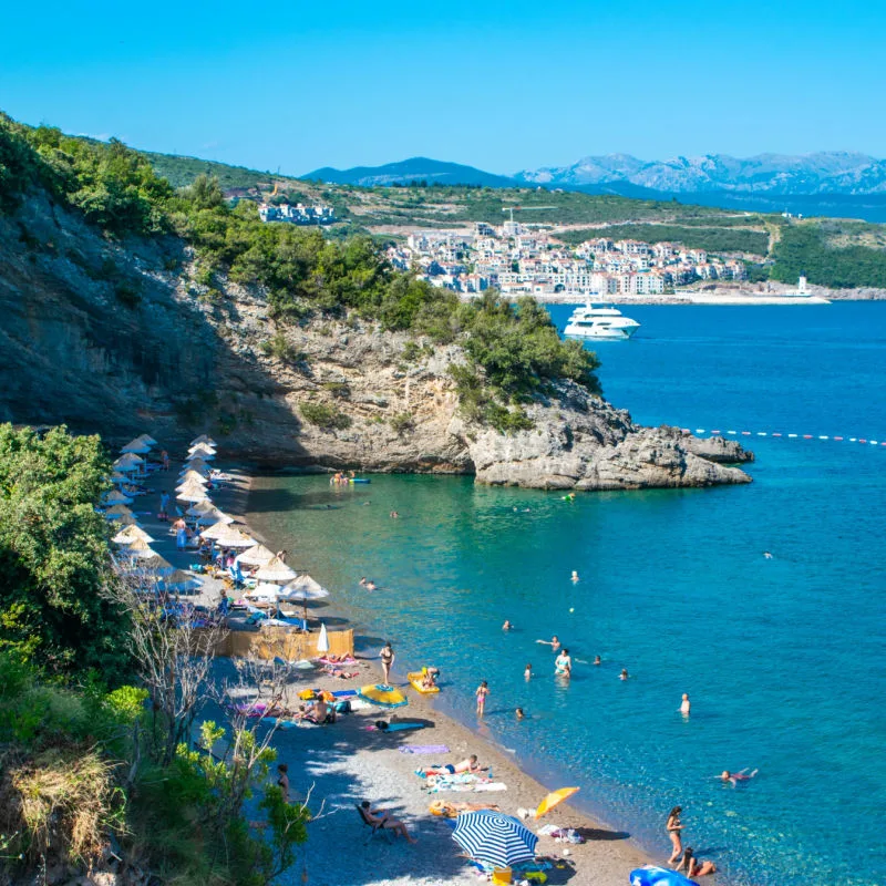 blue water and town at spila beach montenegro