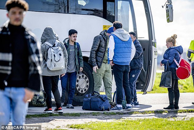 Asylum seekers are seen at an application centre in Ter Apel, Netherlands, on April 2, 2023