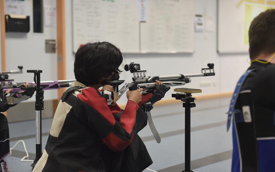 Vilseck’s Adelena Alvarez completes the kneeling portion of the marksmanship competition at the JROTC air rifle range inside Vilseck High School, Vilseck, Germany, on Saturday, Dec. 3, 2022.