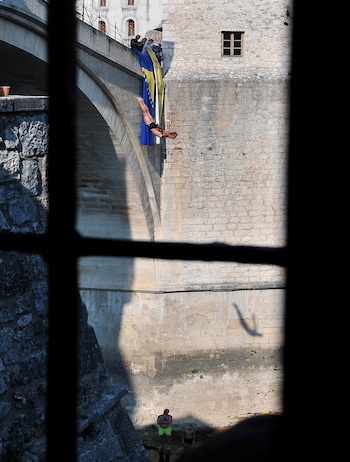 Every July locals dive from the city's bridge