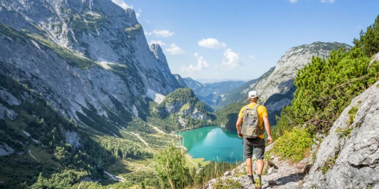 Mountaineer hiking in the mountains at Dachstein, Austria