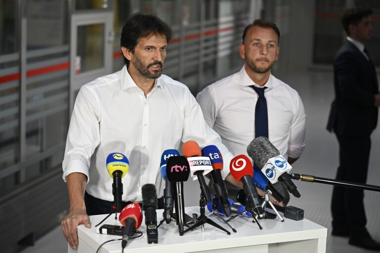 Deputy Prime Minister and Defence Minister of Slovakia Robert Kalinak speaks during a joint press conference with Slovakia's Interior Minister Matus Sutaj Estok, right, at the F. D. Roosevelt University Hospital, where Slovak Prime Minister Robert Fico, who was shot and injured, is treated in Banska Bystrica, central Slovakia, Wednesday, May 15, 2024. Slovak Prime Minister Robert Fico is in life-threatening condition after being wounded in a shooting after a political event Wednesday afternoon, according to his Facebook profile.(AP Photo/Denes Erdos)