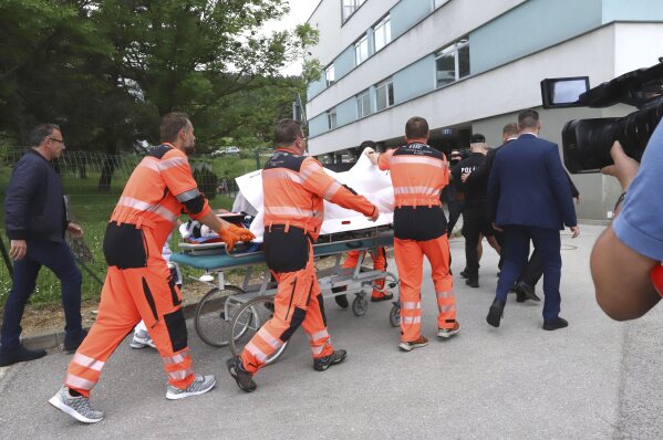 Rescue workers take Slovak Prime Minister Robert Fico, who was shot and injured, to a hospital in the town of Banska Bystrica, central Slovakia, Wednesday, May 15, 2024. Slovakia’s populist Prime Minister Robert Fico is in life-threatening condition after being wounded in a shooting Wednesday afternoon, according to his Facebook profile. (Jan Kroslak/TASR via AP)