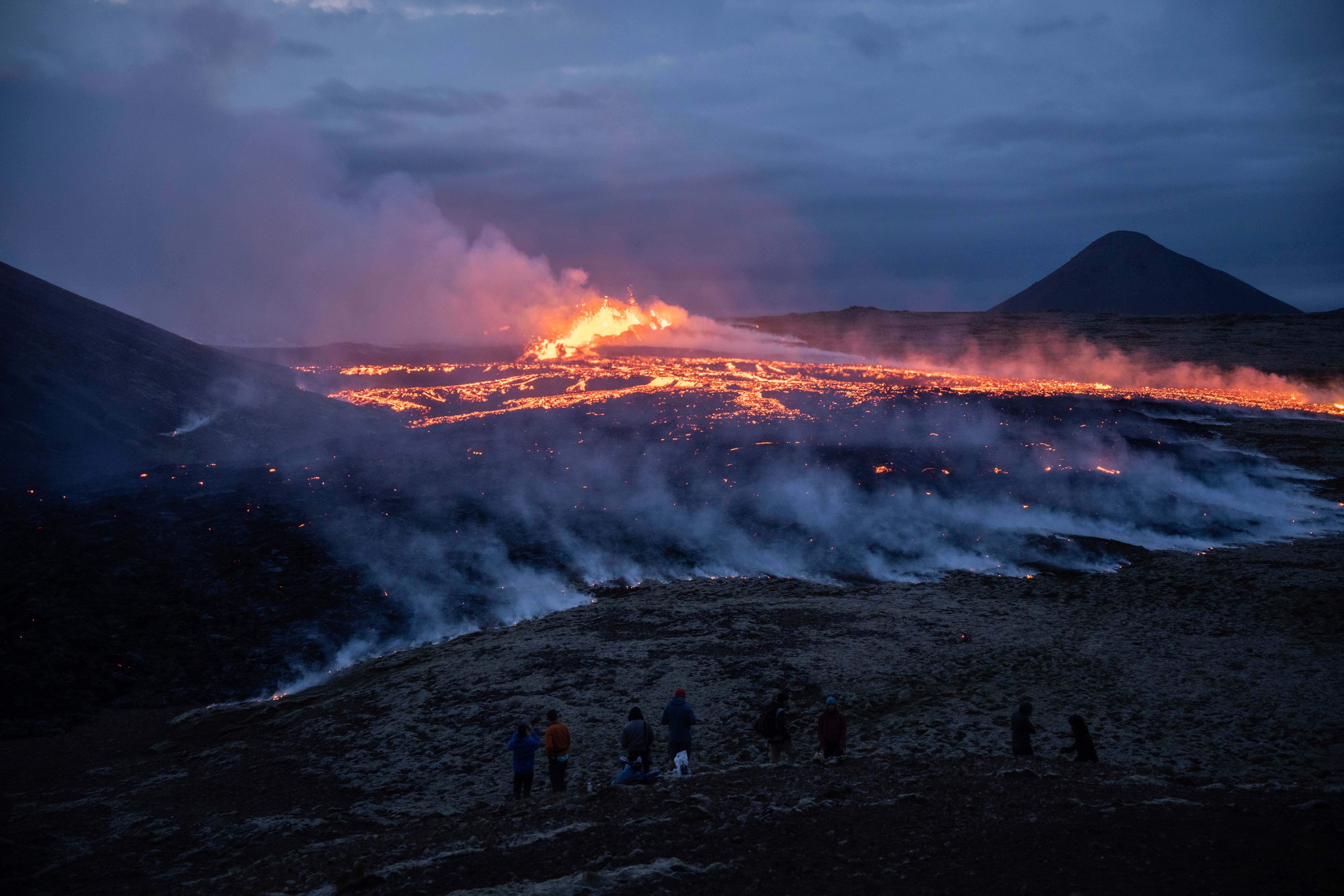 Lava emerges from a fissure of the Fagradalsfjall volcano near the Litli-Hrútur mountain, some 30km (19 miles) southwest of Reykjavik, in July