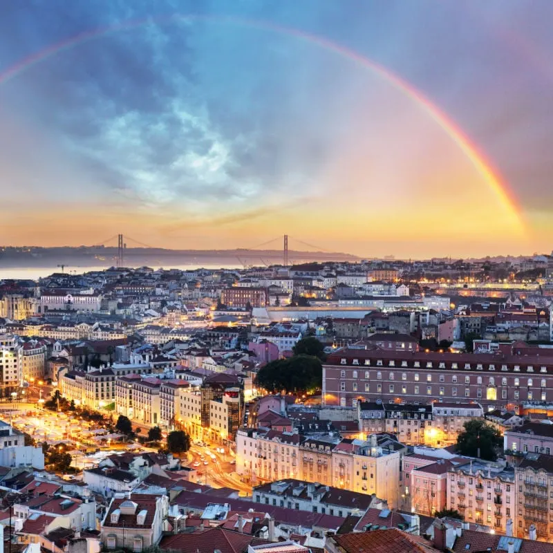 aerial view of lisbon portugal with rainbow