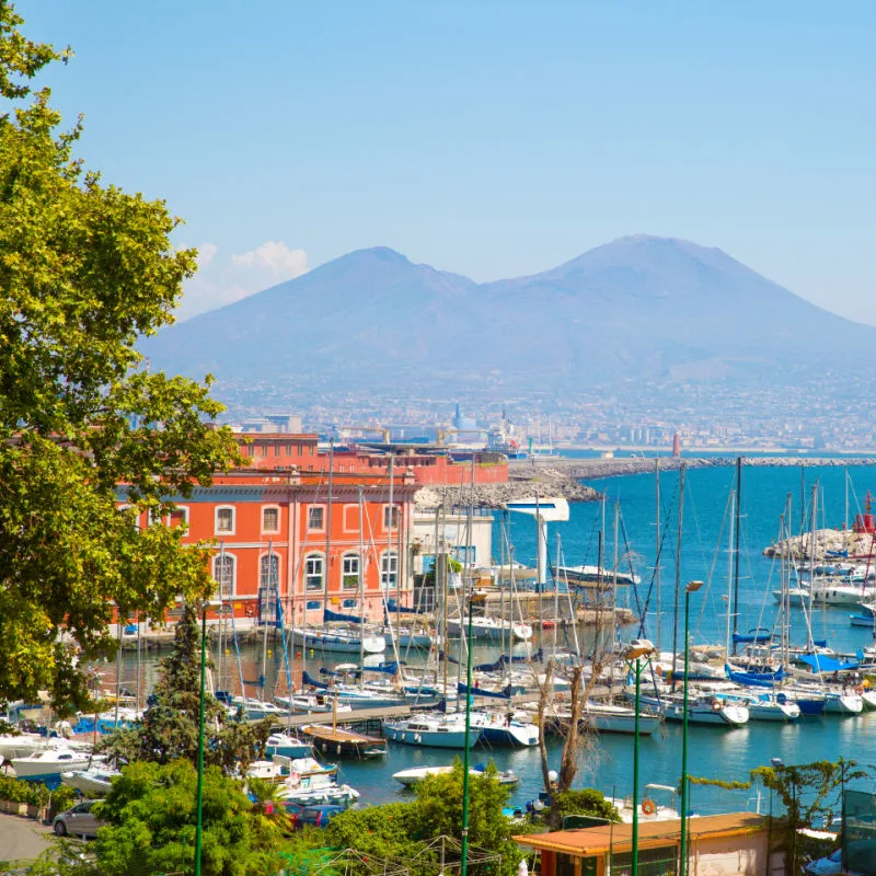 boats and mt vesusis in naples italy