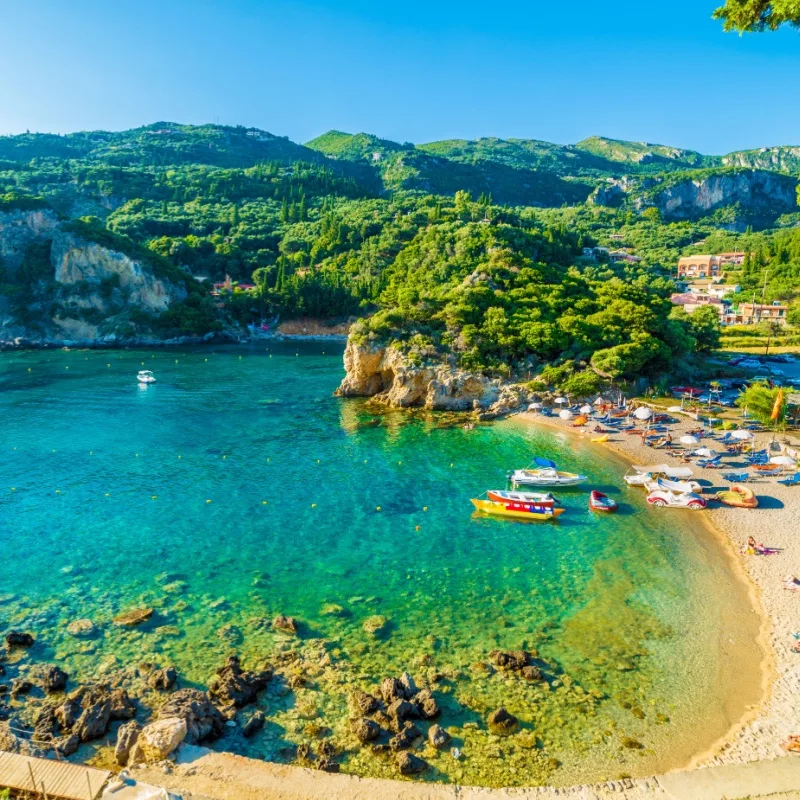 Beautiful beach and boat in Paleokastritsa, Corfu island, Greece