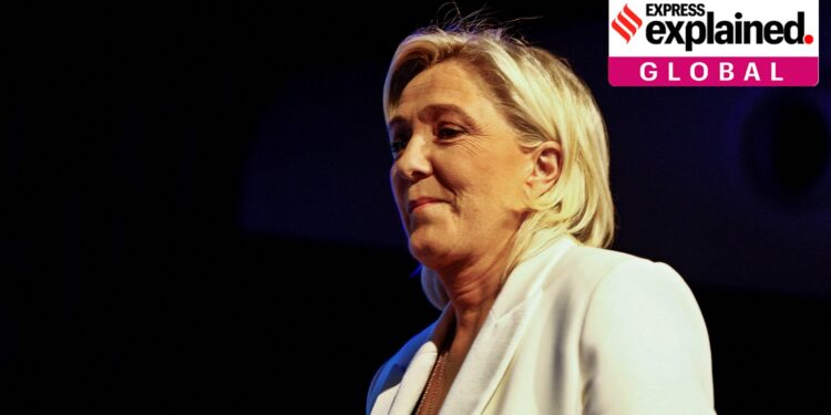 Marine Le Pen, President of the French far-right National Rally (Rassemblement National - RN) party parliamentary group, takes the stage to address party members after the polls closed during the European Parliament elections, in Paris, France, June 9, 2024.