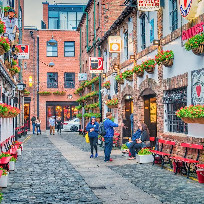 Belfast, Northern Ireland, people walking through street and talking to eachother