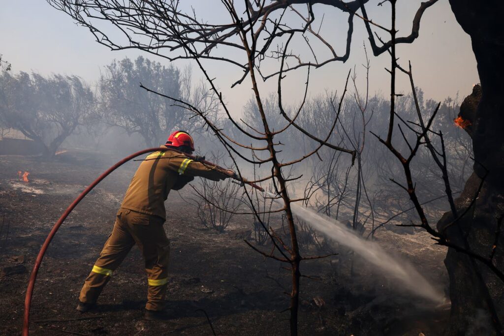 Greece weather latest: Hunt for arsonist suspected of sparking Athens wildfire as search for missing American continues