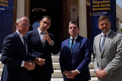 Cypriot Interior Minister Constantinos Ioannou, second left, talks with his counterparts, from left, Austria's Gerhard Karner, Greece's Dimitris Kairides and the Czech Republic's Vit Rakusan during the Ministerial Summit on Migration and Syria Dynamics in Nicosia, Cyprus. AP