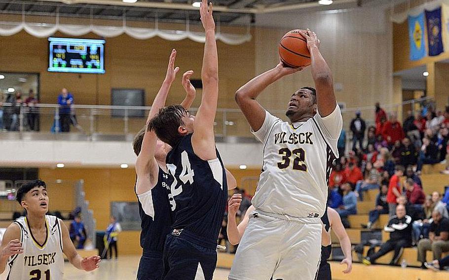 Jonas Matthews of Vilseck gets a shot off against Black Forest Academy in a boys Division I semifinal at the DODEA-Europe basketball championships in Wiesbaden, Germany, in February.

MICHAEL ABRAMS/STARS AND STRIPES