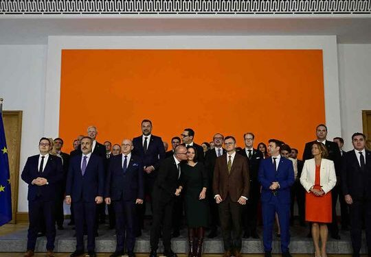 Croatian Foreign Minister Gordan Grlic-Radman attempts to give German Foreign Minister Annalena Baerbock a kiss as the pose for a family photo during a Ministerial Conference on the issues of EU enlargement, EU reforms and the EU