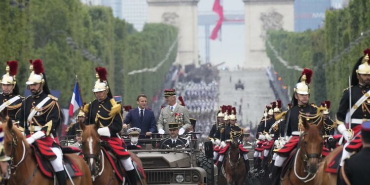 France celebrates Bastille Day amid virus fears, tensions