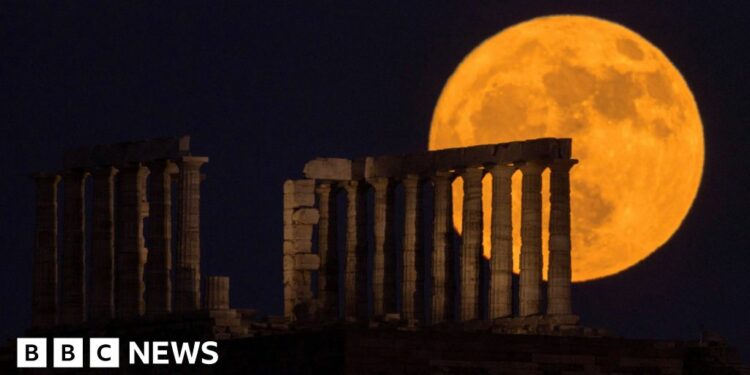 June full Moon rises behind Greece's Temple of Poseidon