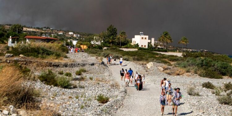 Tourists flee Rhodes wildfires in Greece’s largest-ever evacuation