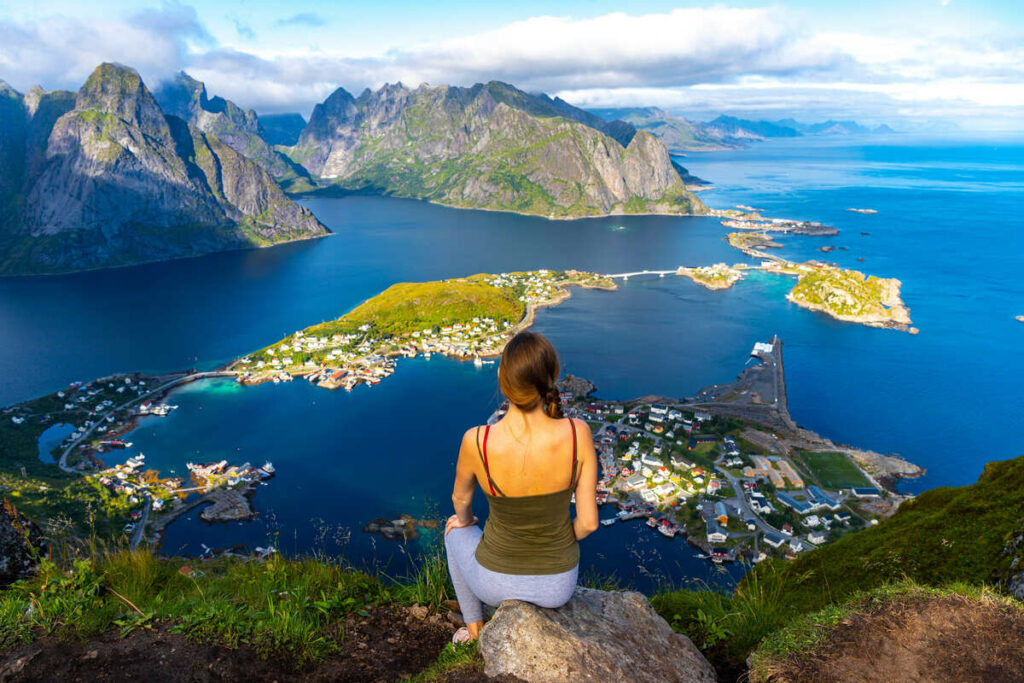 Young Woman Admiring Views Of Lofoten From A Viewpoint In Northern Norway, Scandinavia, Northern Europe.jpg