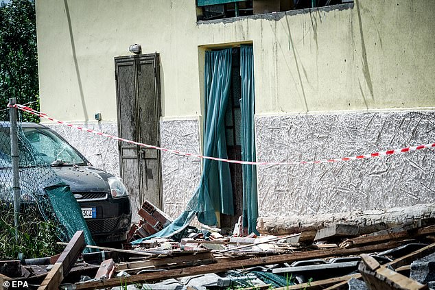 ebris from a roof damaged by a whirlwind in Busano Canavese, near Turin, Italy, June 30