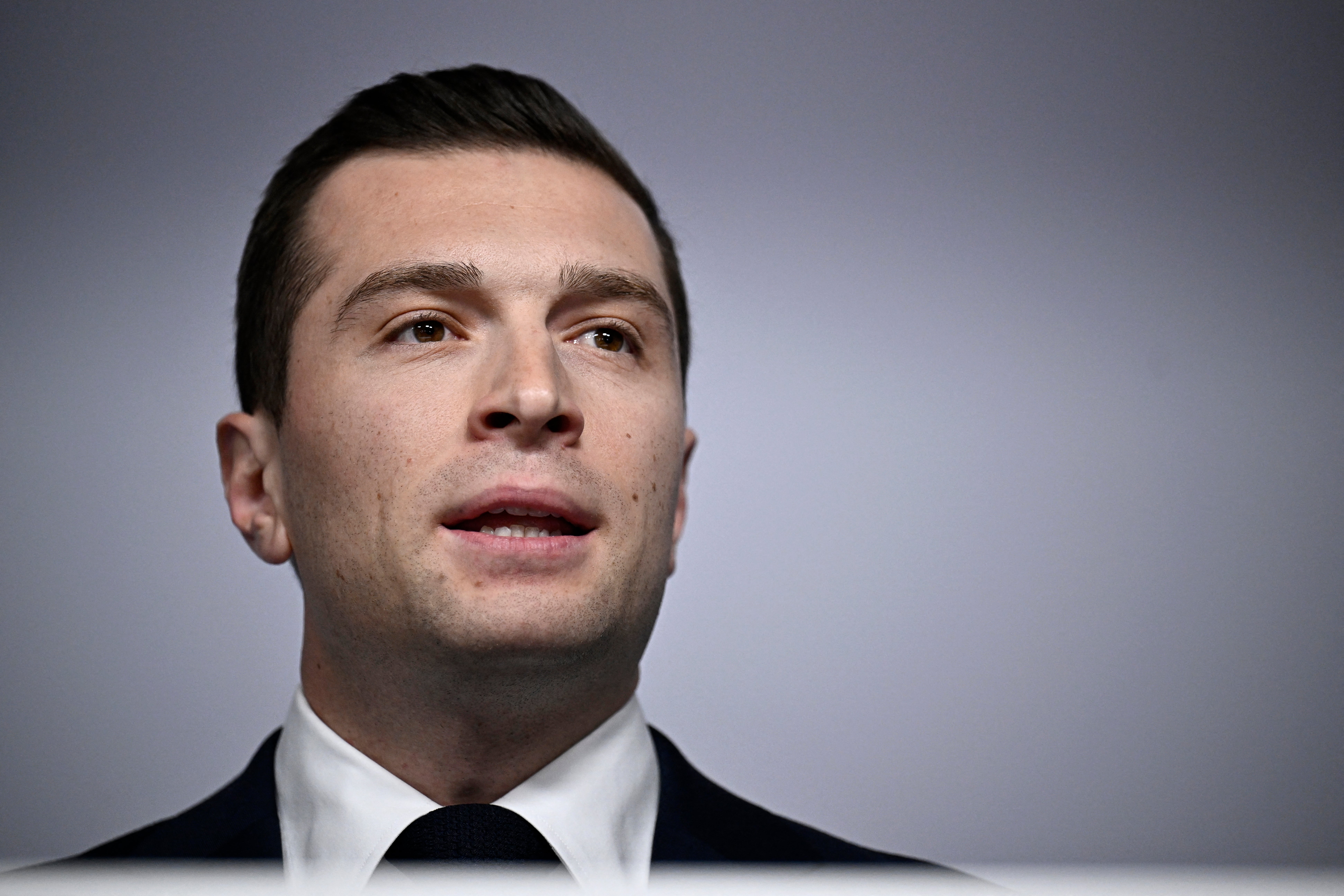 French far-right Rassemblement National (RN) political party President and lead MEP Jordan Bardella looks on as he gives a speech during the results evening of the first round of the parliamentary elections in Paris