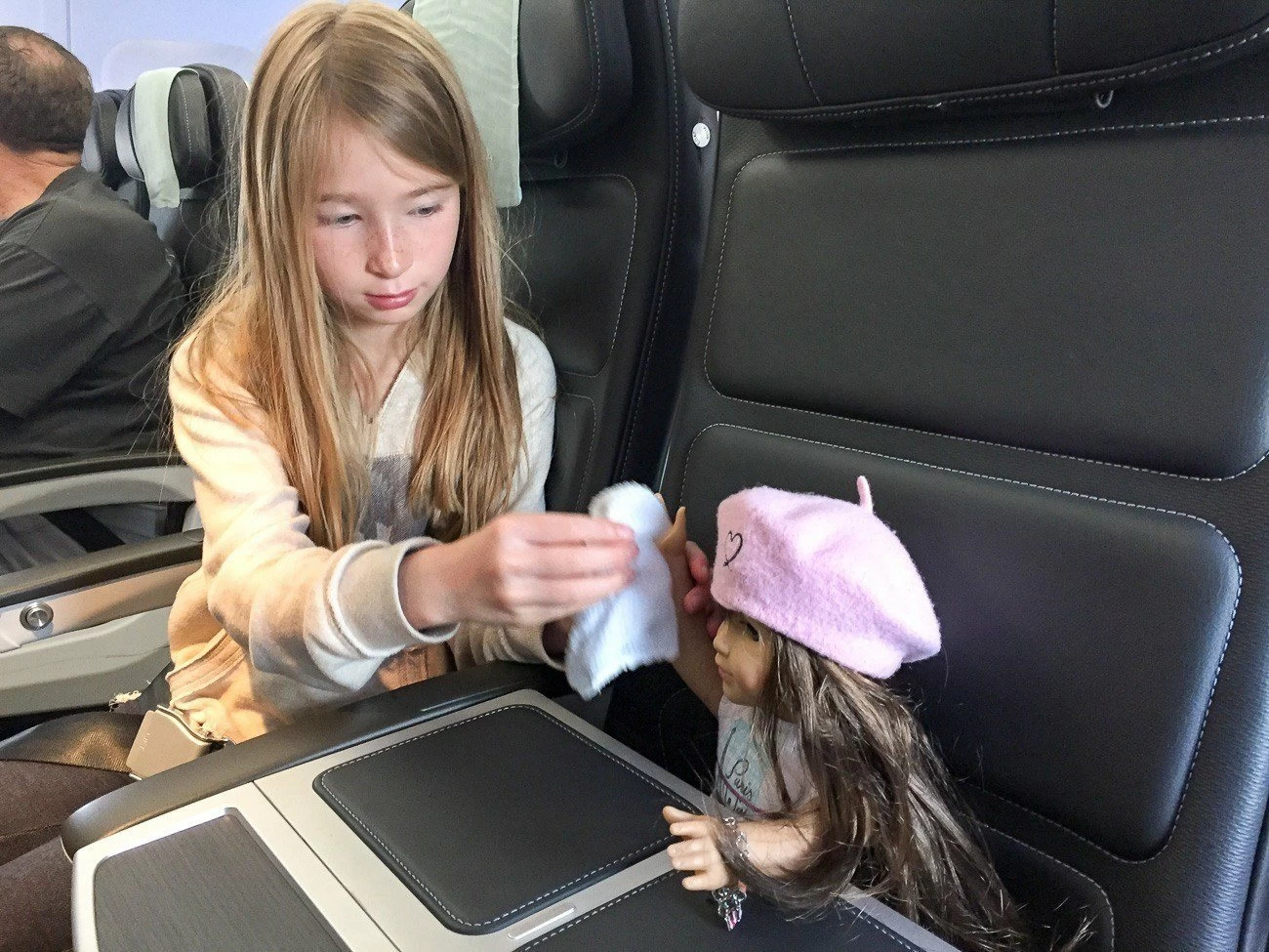 My daughter cleans her doll's hands in a seat on British Airways Club Europe (business class) from London Heathrow to Paris. 