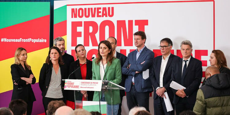 Group of politicians in front of Nouveau Front Populaire sign