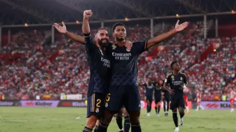 Getty Images Real Madrid players Dani Carvajal and Jude Bellingham celebrate a goal 