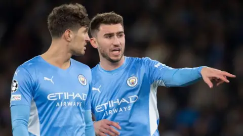 Getty Images Manchester City defenders John Stones and Aymeric Laporte 