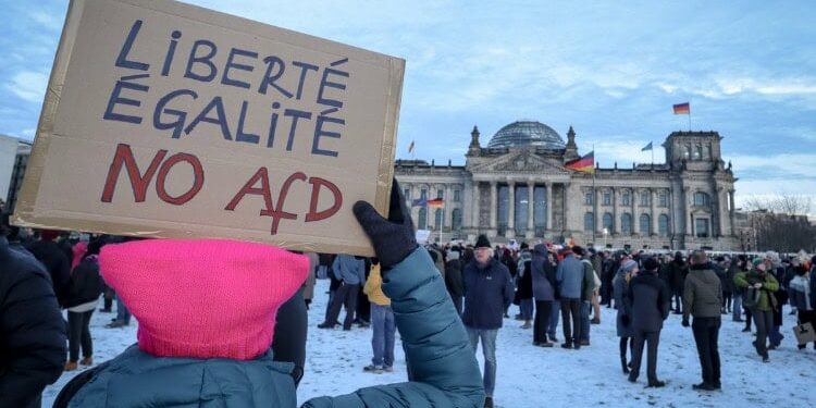 Woman with placard reading