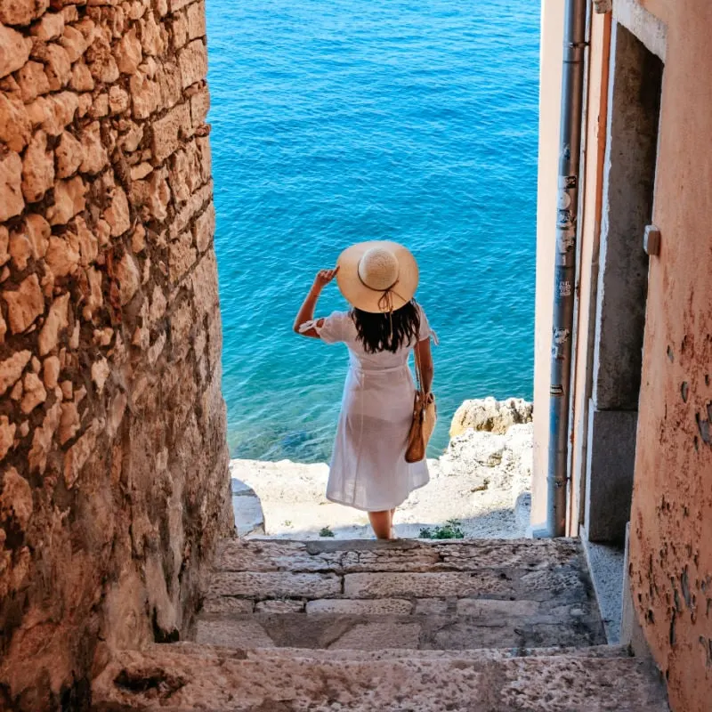 woman in an alleyway in istria region of croatia