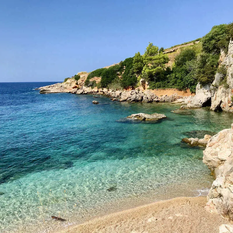 A Beautiful Beach Bounded By The Crystal Clear Waters Of The Adriatic Sea In Hvar Island, An Island Off Mainland Dalmatia, Croatia, Southern Europe