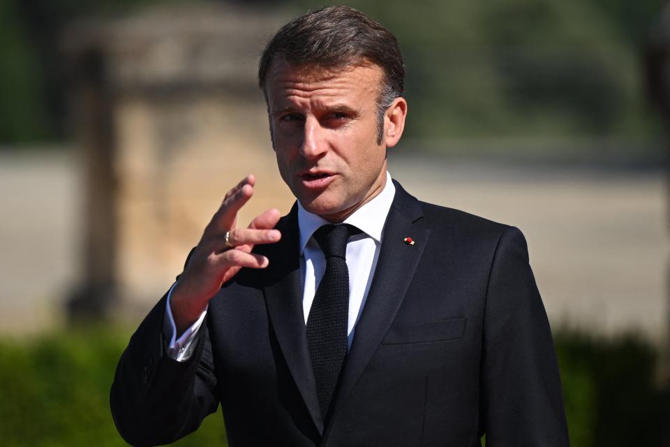 France's President Emmanuel Macron gestures as he  arrives to attend the European Political Community meeting (AFP via Getty Images)