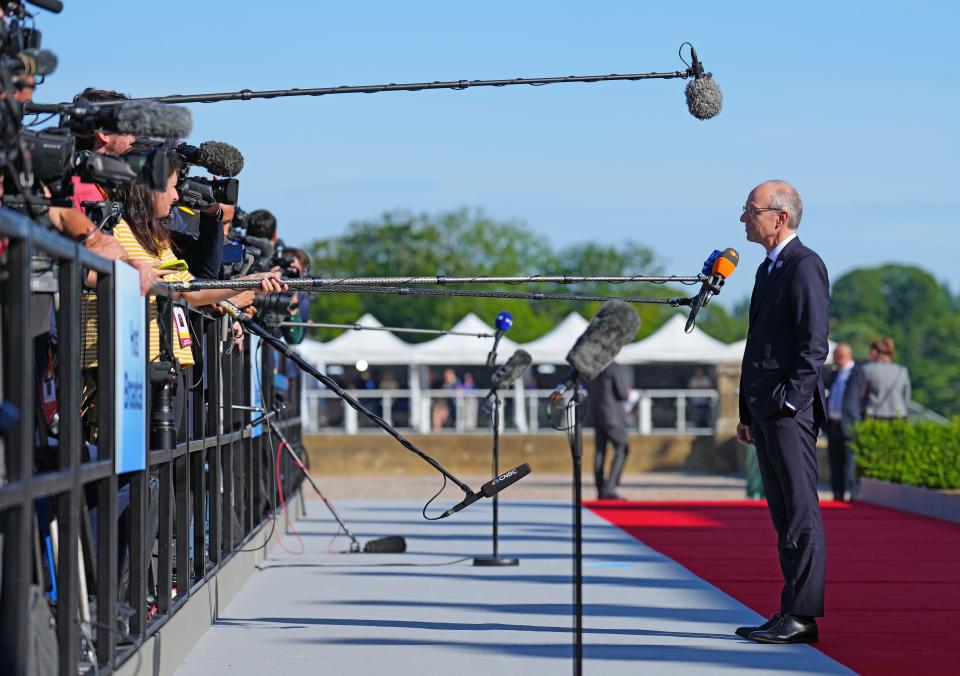 Prime Minister of Luxembourg Luc Frieden talks to the press as he arrives for the European Political Community Summit at Blenheim Palace on July 18, 2024 in Woodstock, England (Getty Images)