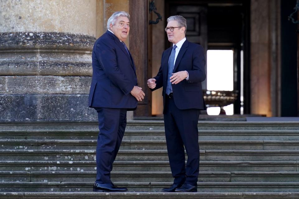 The Minister of State of Monaco Pierre Dartout (L) is welcomed by Britain's Prime Minister Keir Starmer to the European Political Community summit at Blenheim Palace (Getty Images)