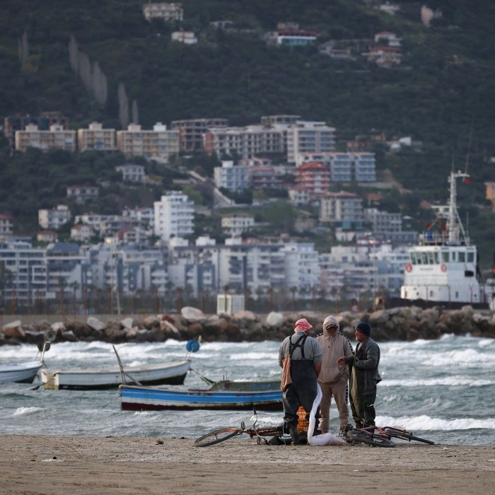 Fishermen by the sea in Albania