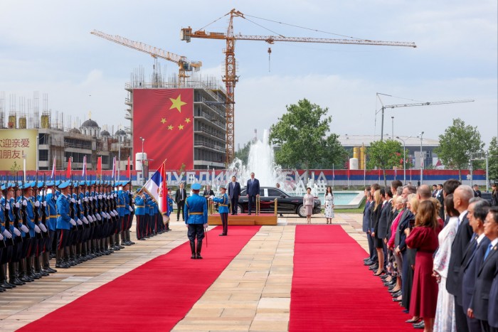 Serbia’s president stands with Xi Jinping during the Chinese leader’s visit to Belgrade in May