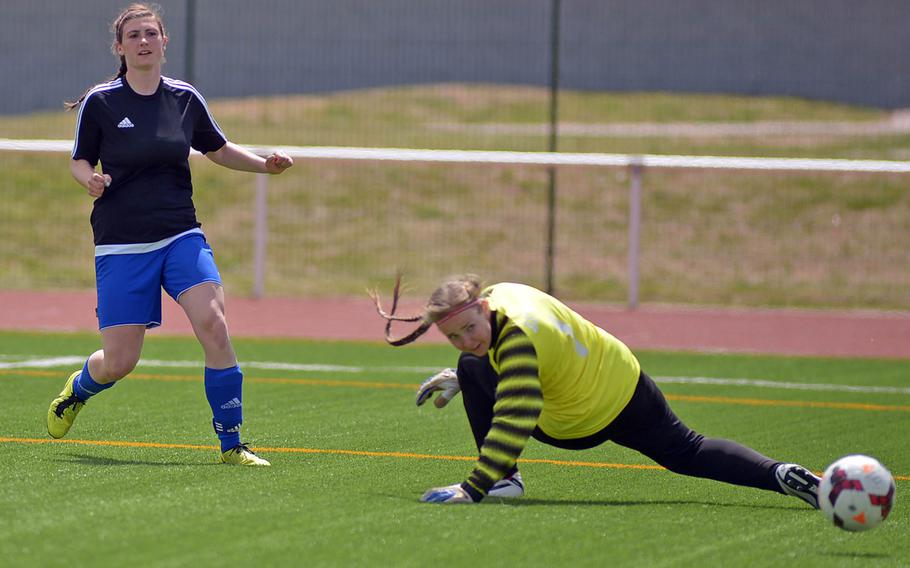 Hohenfels' Amelia Heath and AFNORTH keeper Frida Lund watch Heath's shot bounce into the goal for the game's only score as Hohenfels beat the Lions 1-0 in the girls Division II final at the DODDS-Europe soccer championships in Kaiserslautern, Germany. It was the first-ever girls soccer title for the Tigers.