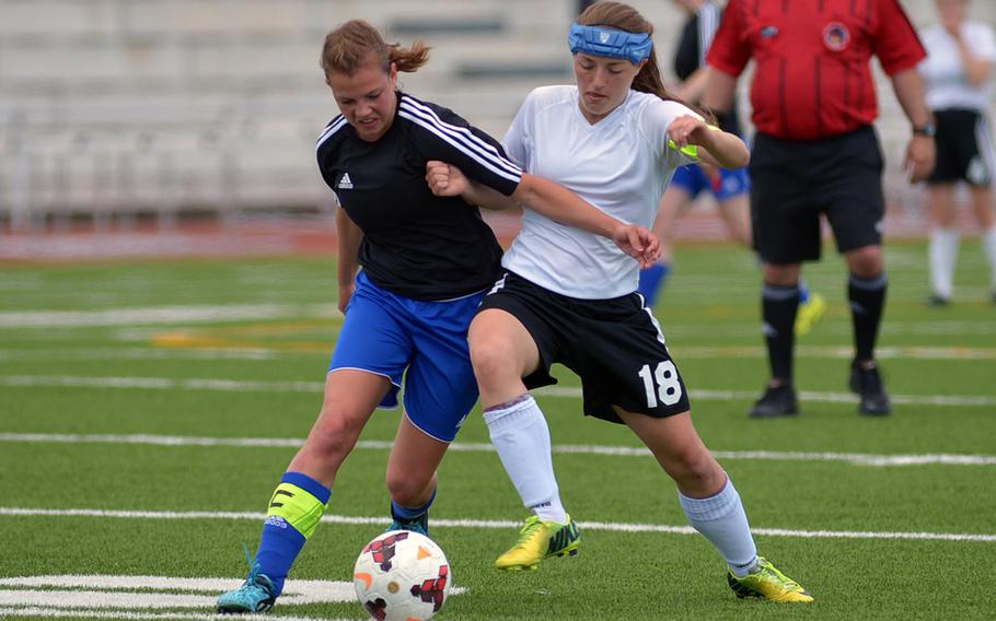 Hohenfels' Shelby Atkinson, left, and AFNORTH's Caitlyn Helwig battle for the ball in the girls Division II final at the DODDS-Europe soccer championships in Kaiserslautern, Germany. Atkinson was named DODDS-Europe's girls Athlete of the Year for her efforts in volleyball, basketball and soccer where the Tigers took the Division II title.