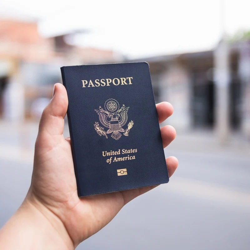 American Traveler Holding Up A US Passport