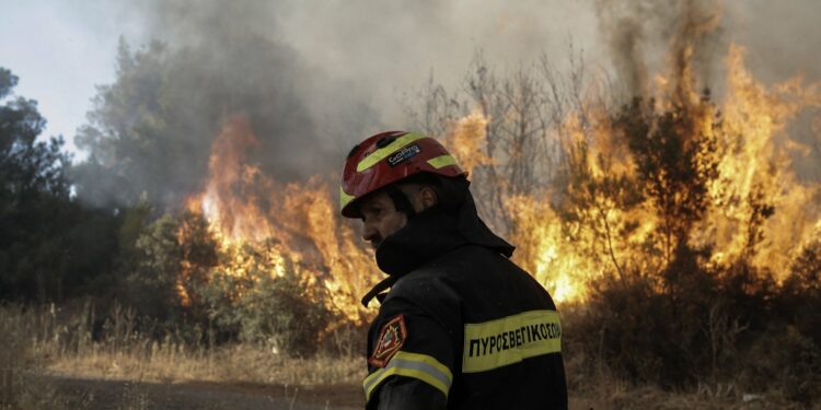 Greece tackles dozens of wildfires brought on by earliest heat wave