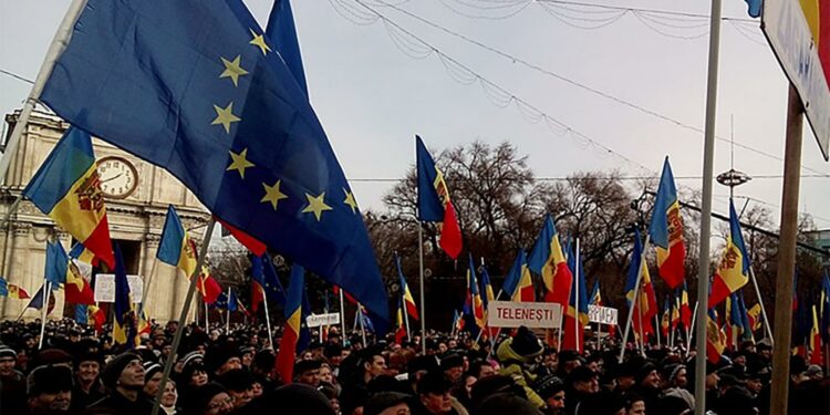 Moldovans demonstrate in Chisinau, the capital, in support of closer ties to Europe in 2016. Six years on, those aspirations yielded a start to Moldova’s formal accession talks with the European Union in June. (Giku/CC License 1.0)