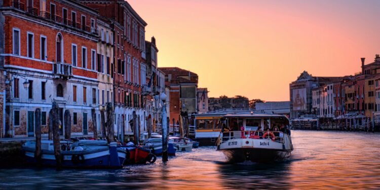 Venice showing a boat on a canal