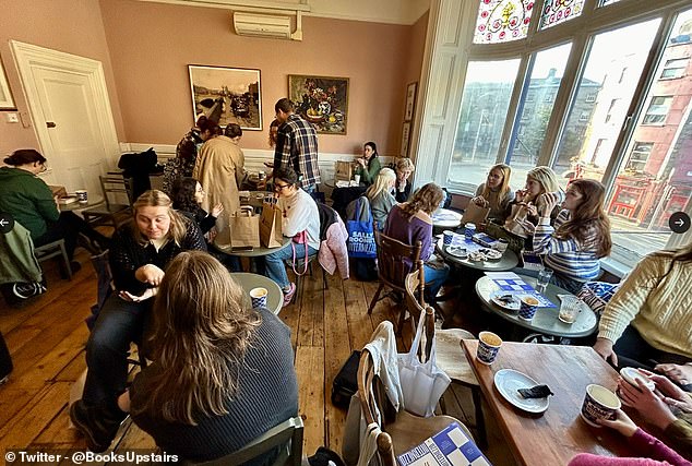 After securing a copy of the new release, fans sought refuge from the chilly September morning, as they were pictured enjoying a hot drink inside the Dublin book shop