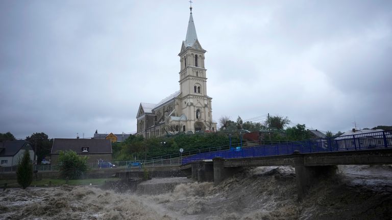 The Bela River flows past a church during floods in Mikulovice, Czech Republic. Pic: AP