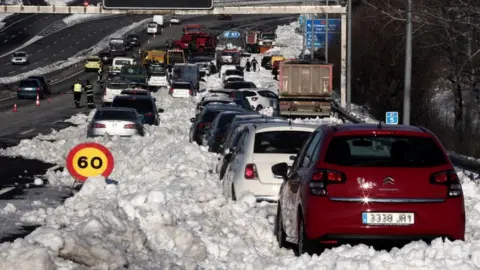 Getty Images Cars stuck in snow on M-40, Madrid, 11 Jan 21