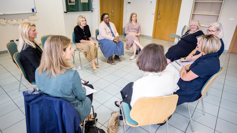 President Camille N. Johnson and Sister Tracy Y. Browning sit in a circle with with regional leaders in Milan, Italy.