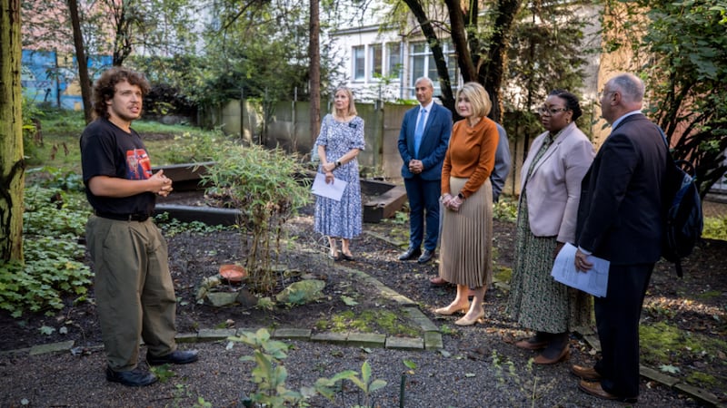 President Camille N. Johnson and Sister Tracy Y. Browning visit a garden at Jako doma, a shelter for homeless women in Prague, Czech Republic.