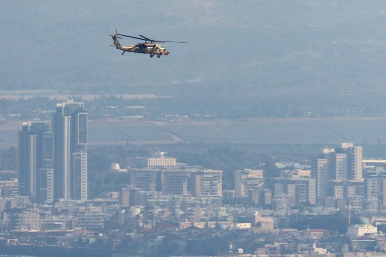 An Israeli Black Hawk helicopter flies over Israel's northern city of Haifa on September 26, 2024. The United States and its allies pressed for a 21-day ceasefire in the sharp escalation of fighting between Israel and Hezbollah that has threatened to plunge Lebanon into an all-out war. (Photo by Jack GUEZ / AFP) (Photo by JACK GUEZ/AFP via Getty Images)