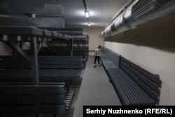 A girl exploring a nuclear shelter in Kyiv on September 26. The Cold War-era shelter was renovated and opened to the public late last year.