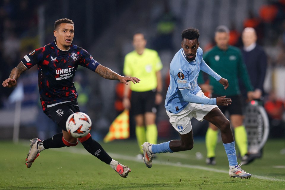 Glasgow Rangers’ English defender James Tavernier vies for the ball with Malmo's Taha Ali